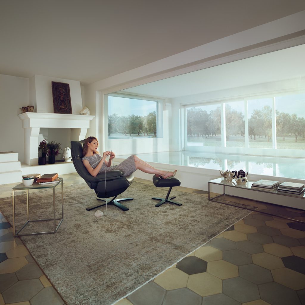 Woman Relaxing on Re-Vive - Bedroom Furntiture in San Diego